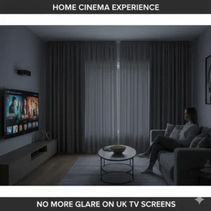 Elegant floor-to-ceiling charcoal blackout curtains used in a contemporary living room to prevent glare on a television screen.