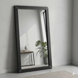 Alt text for image 3: Large black metal industrial style leaner mirror placed in a contemporary hallway.