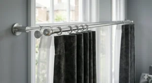 Black double curtain poles installed for layering heavy velvet drapes with light sheers.