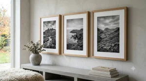 Trio of landscape photographs displayed in matching wooden framed prints.
