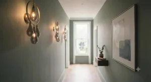 Cozy bedroom interior featuring oversized statement light fixtures styled as bedside reading pendants.