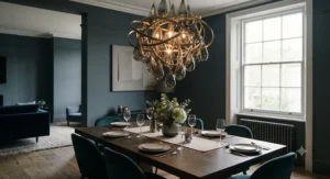 Large statement pendant light suspended over a wooden dining table in a stylish London home.