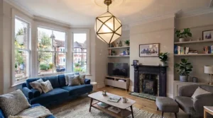 Coordinating large living room ceiling lights defining zones in an open-plan kitchen diner extension.