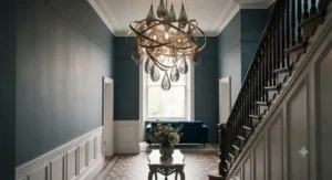 Oversized statement light fixtures installed in a traditional British period property with high ceilings and cornicing.